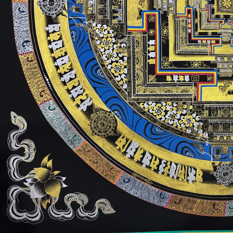 May include: A detailed mandala with intricate patterns and gold accents. The mandala is surrounded by a border of swirling clouds and a lotus flower. The mandala is painted on a black background.
