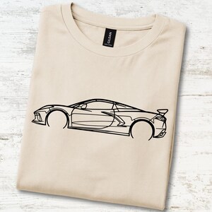 T-shirt with a black outline graphic of a sports car.