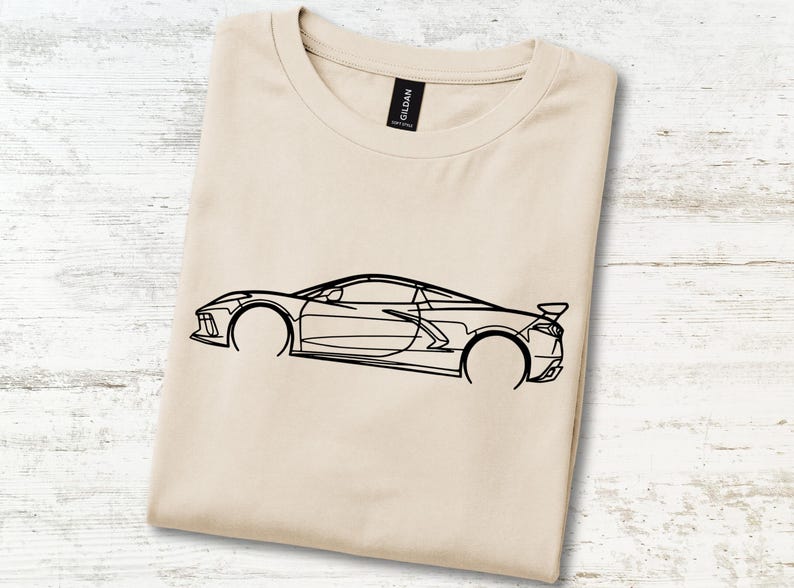 T-shirt with a black outline graphic of a sports car.