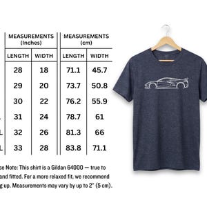Dark navy t-shirt with white outline of a sports car and size chart.