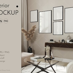 May include: A living room interior mockup featuring a beige wall and a wooden console table. The table has a vase with dried flowers, a book, and a decorative object. There are four black framed pictures on the wall above the table. A glass coffee table with a book on it is in the foreground.
