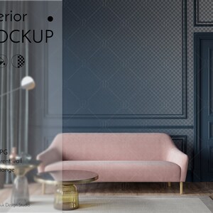 May include: A pink sofa sits in a room with a dark blue wall and a closed door. The wall has a decorative molding around the edges. The room has a wooden floor and a rug.