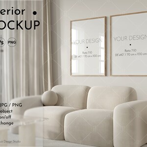 May include: Interior mockup featuring two framed prints with the text "YOUR DESIGN" and dimensions of 28x40 inches (70 cm x 100 cm). The frames are displayed above a cream-colored sofa. The image also includes the text "Interior MOCKUP".