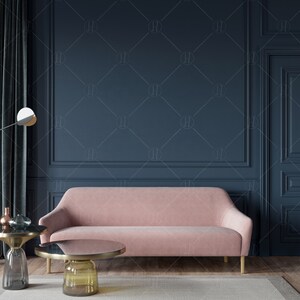 May include: A pink velvet sofa with gold legs sits in a room with dark blue walls and a dark blue door. There are two gold and glass coffee tables in front of the sofa.