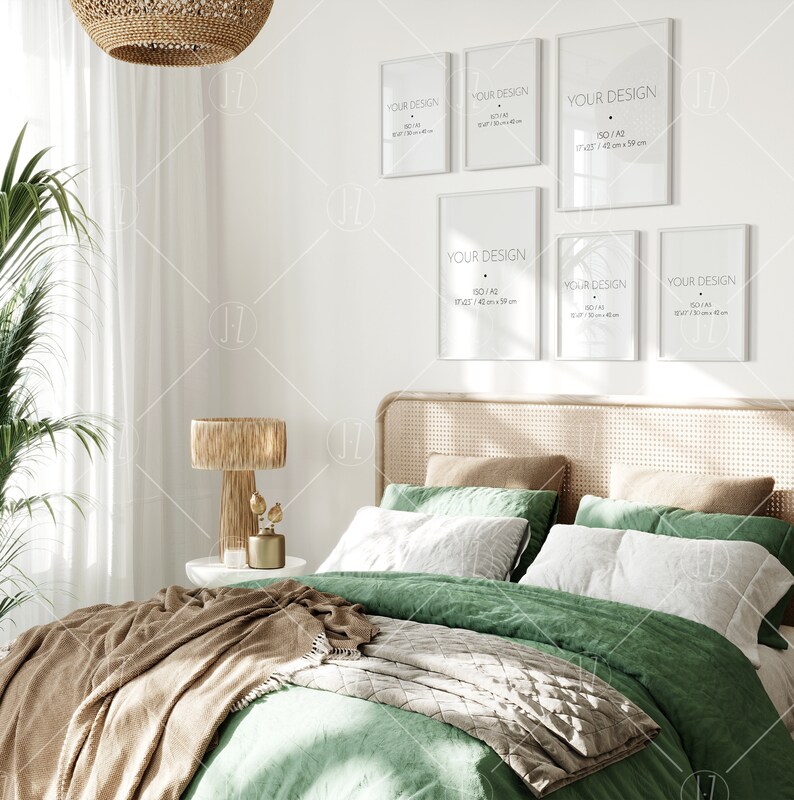 May include: A green bed with a brown blanket and a wicker headboard. There are five framed posters on the wall behind the bed. The posters are all white with black text that says "YOUR DESIGN" and the size of the poster in inches and centimeters.