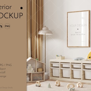 May include: A mockup of a nursery room interior with a white frame on the wall, a wooden toy shelf with storage bins, and a dollhouse with toys. The frame has the text "YOUR DESIGN" and "Ratio 2:3 24"x36"/61 cm x 91 cm".