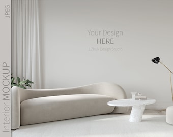 May include: A white, curved sofa sits in a modern living room with a white marble coffee table and a gold floor lamp. The wall is blank and has the text "Your Design HERE J.Zhuk Design Studio" written on it.