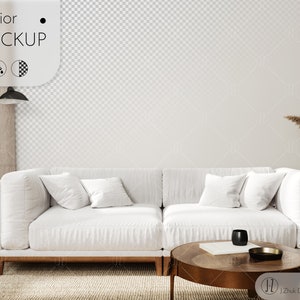 May include: A white sectional sofa with three pillows sits in front of a white wall with a checkered pattern. A small wooden table with a black cup and a gold tray sits in front of the sofa. A wooden floor with a woven rug is visible in the foreground.