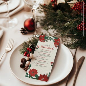 May include: A Christmas menu with a festive design featuring poinsettia flowers and holly berries. The menu lists the following items: Sopa de Pavo y Verduras, Pavo Relleno al Horno, Salmon al Horno, Tronco de Navidad, Tronco de Navidad.