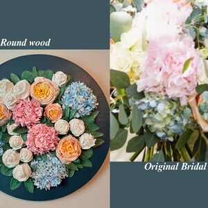 May include: An 18-inch round wooden floral arrangement featuring a variety of flowers in shades of pink, orange, white, and blue. The arrangement is set against a dark teal background. The text "Original Bridal Bouquet" is also visible.