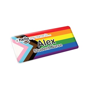 May include: A white name tag with a rainbow pride flag design. The text on the tag reads "#hello my name is... Alex Student Nurse".