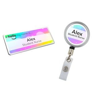 May include: Two name badges. One is rectangular with the text "#hello my name is..." and "Alex Student Nurse" on a pastel background. The other is a round retractable badge with the same text and a silver border.