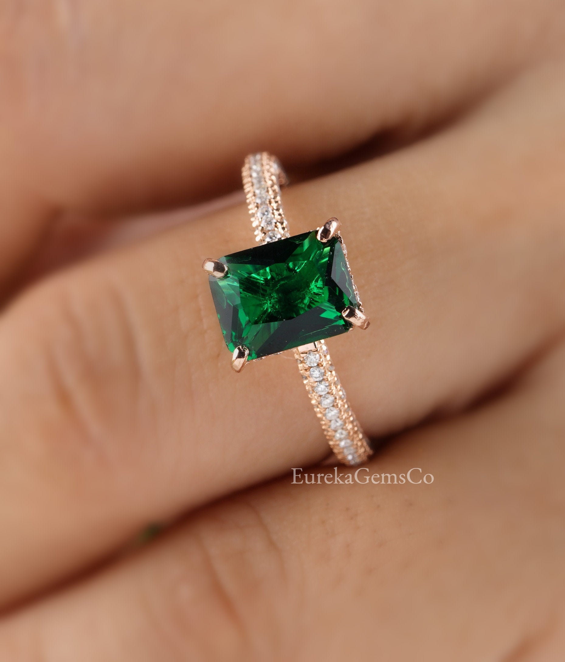 Radiant cut emerald sale ring