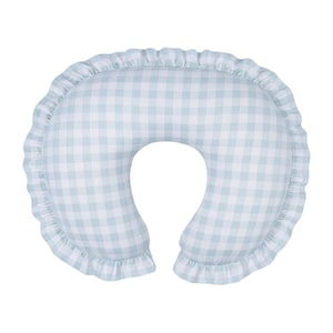 May include: A light blue and white gingham nursing pillow with a ruffled edge. The pillow has a U-shape design, ideal for supporting the baby and the mother during breastfeeding. The pillow is made of soft fabric.