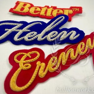 May include: Three embroidered patches featuring raised gold and silver bullion wire lettering. The top patch reads Better in gold on red felt. The middle patch reads Helen in silver on blue felt. The bottom patch reads Cremey in gold on red felt.