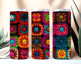 May include: Three stainless steel tumblers with colorful crocheted designs. The designs feature a variety of colors, including red, orange, yellow, green, blue, and purple.
