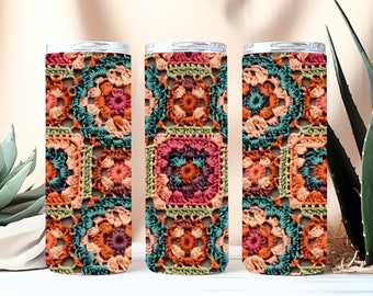 May include: Three stainless steel tumblers with a colorful crocheted pattern. The pattern features squares with a variety of colors, including orange, green, pink, and brown.