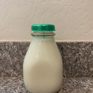 Vela de garrafa de leite