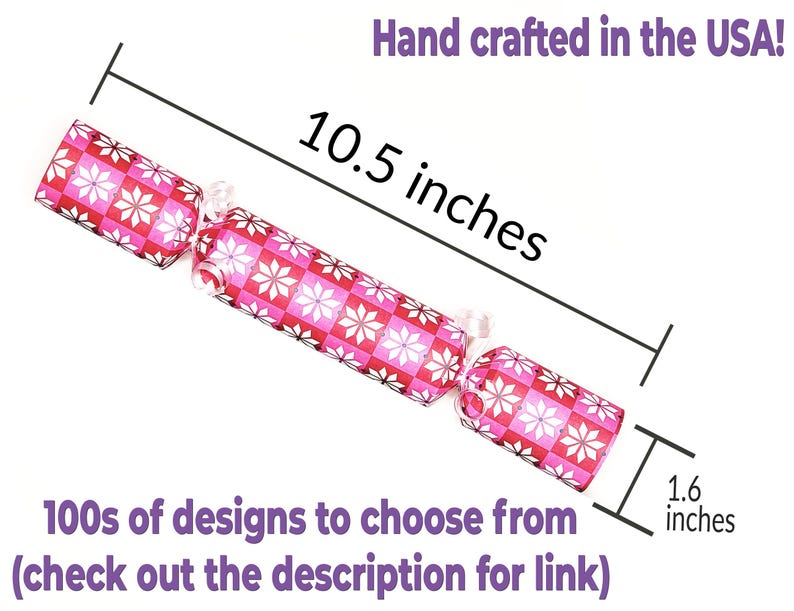 May include: A decorative cracker with a pink and white floral pattern. It measures 10.5 inches long and 1.6 inches wide. The text "Hand crafted in the USA!" and "100s of designs to choose from (check out the description for link)" are also visible.