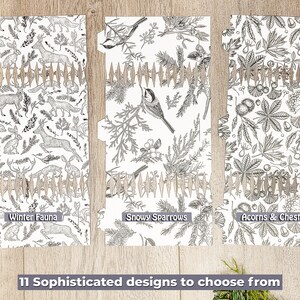 May include: Three decorative paper dividers with unique black and white nature-themed designs. The designs include "Winter Fauna" with deer and rabbits, "Snowy Sparrows" with birds, and "Acorns & Chestnuts" with leaves. The text reads "11 Sophisticated designs to choose from."