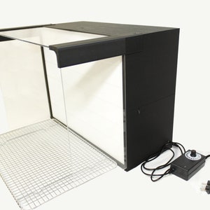 May include: Black spray booth with a clear plastic top, a metal wire rack, and a black power adapter with a dial.