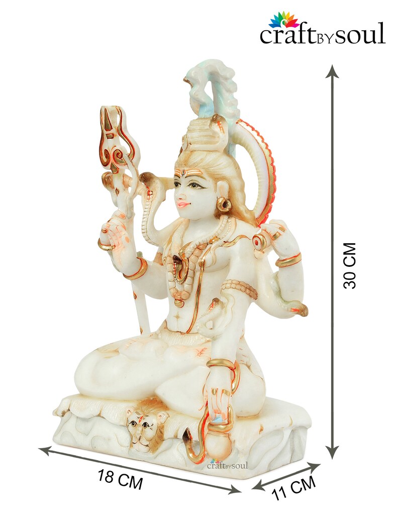 May include: A white and gold statue of a seated deity, 11 cm wide, 18 cm long, and 30 cm tall. The statue features multiple arms, ornate jewelry, and a trident. The base of the statue has a lion's head. The product is from craftbysoul.