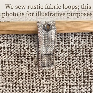 May include: A textured beige and brown woven fabric panel featuring a light-colored wooden rod inserted through a fabric loop with a metal grommet. The text "We sew rustic fabric loops; this photo is for illustrative purposes." is visible.