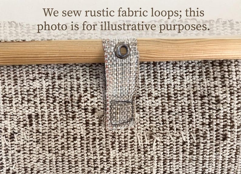 May include: A textured beige and brown woven fabric panel featuring a light-colored wooden rod inserted through a fabric loop with a metal grommet. The text "We sew rustic fabric loops; this photo is for illustrative purposes." is visible.