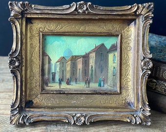 Pintura al óleo de un paisaje urbano italiano vintage: arte naif firmado en un marco ornamentado.