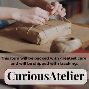 May include: A wrapped package in brown paper is being tied with twine. The hands of a person are visible, carefully securing the twine around the package. The text "CuriousAtelier" is displayed below the package.