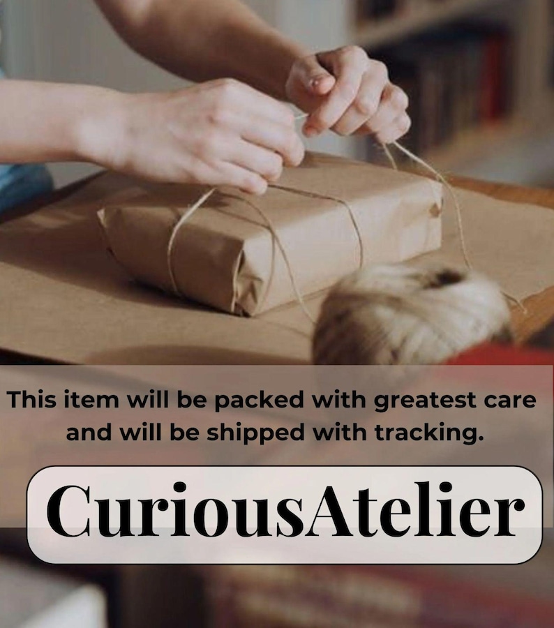 May include: A wrapped package in brown paper is being tied with twine. The hands of a person are visible, carefully securing the twine around the package. The text "CuriousAtelier" is displayed below the package.