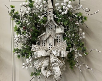 Winter House with Greenery and Bow. Country Farmhouse Winter Wreath with Berries and Bow. Winter Church Wreath with greenery.