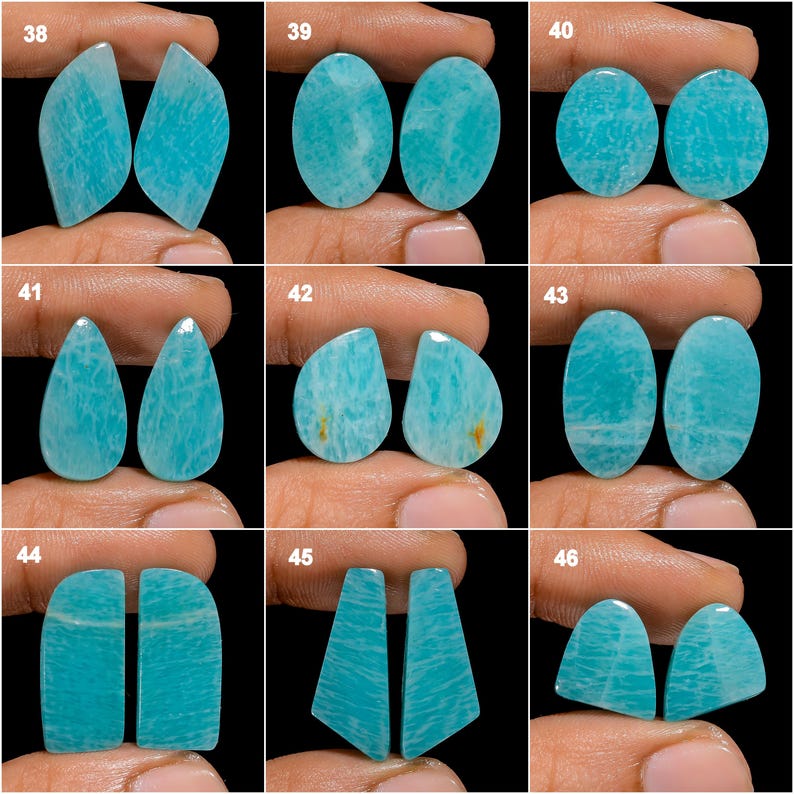 May include: Set of 10 pairs of teal blue amazonite cabochons, each pair is numbered 38-46. The cabochons are smooth and polished, with a variety of shapes and sizes.