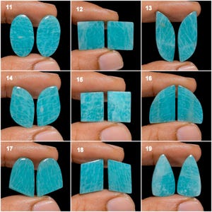 May include: Set of 19 pairs of turquoise green amazonite cabochons, each pair is a different shape and size. The cabochons are smooth and polished, with a natural, organic look.