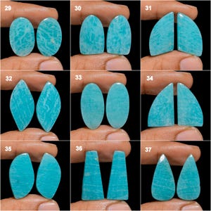 May include: A set of 10 pairs of turquoise green amazonite cabochons, each pair is numbered 29-37. The cabochons are various shapes, including oval, teardrop, and diamond.