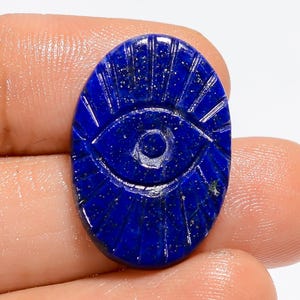 Oeil de lapis-lazuli naturel, forme ovale, cabochon de lapis-lazuli sculpté, 24 x 17 x 3 mm, pierre sculptée de lapis lazuli bleu 12 carats