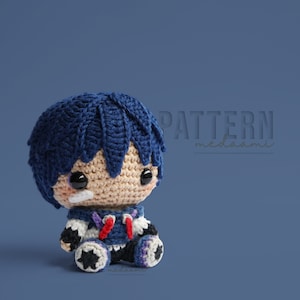 May include: A crocheted amigurumi toy of a blue-haired character with a white and blue outfit. The toy has a stitched-on face with black eyes and a white bandage. The toy is sitting on a blue background with the text "PATTERN medasami" in white.
