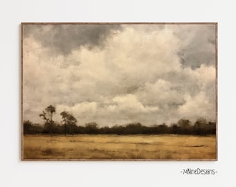 May include: A framed landscape painting featuring a field of golden grass under a cloudy sky. The artwork has a vintage aesthetic with muted tones of brown, beige, and gray. The artist's signature is in the bottom right corner.