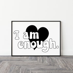 May include: Black and white framed wall art featuring a heart graphic with the text 