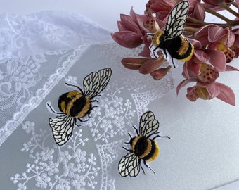 Embroidered patch, of three bees