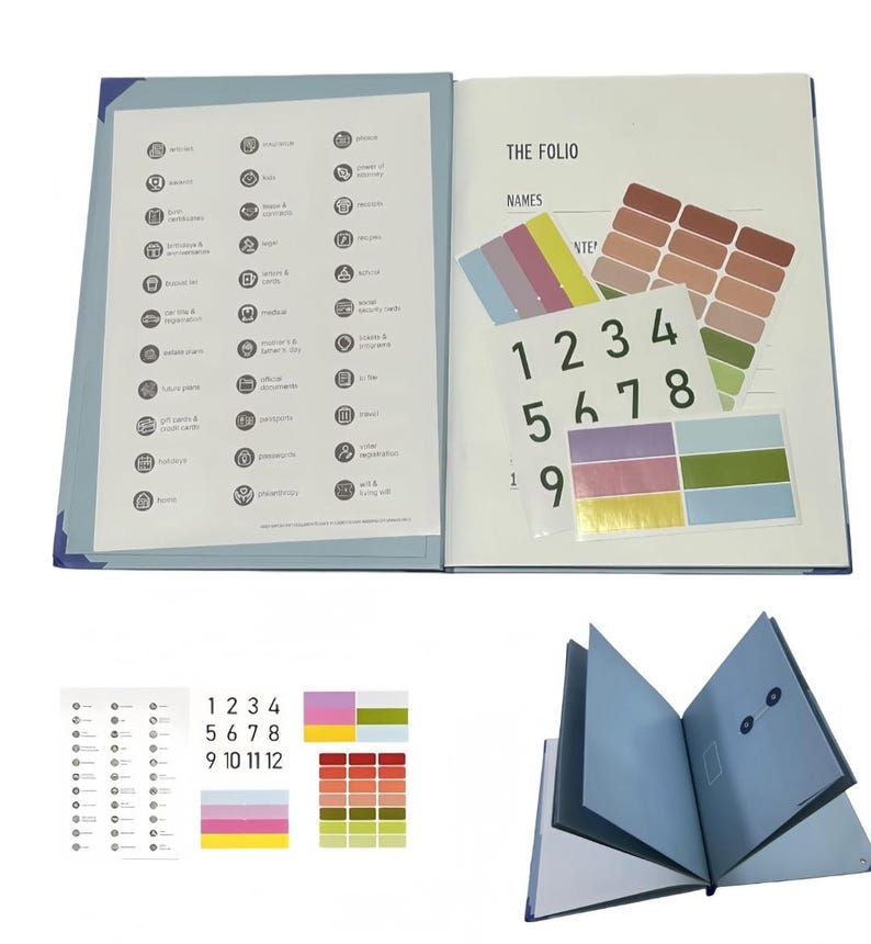 May include: A blue document organiser folio titled THE FOLIO, featuring an internal list of categories with icons, a sheet of numbered stickers from 1 to 12, and multiple sets of rectangular colour-coded adhesive labels in various shades.