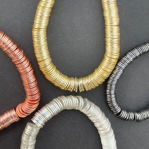 A Strand of Flat Disc,Round Disc, Gold Finish ,Silver Plated And Gunmetal E-coated, Brushed Copper spacers in Four Size:,4mm,6mm,8mm,10mmetc
