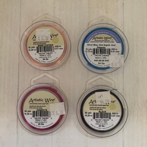 May include: Four spools of Artistic Wire, each with a different color: bare copper, magenta, black, and silver blue. Each spool is labeled with the color, the wire gauge, the length in yards and meters, and the wire diameter in inches and millimeters.