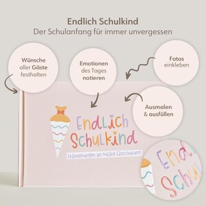 Peut inclure: Un livre de souvenirs rose clair intitul&eacute; Endlich Schulkind avec un graphique de cornet d'&eacute;cole. La couverture pr&eacute;sente du texte en allemand et des bulles circulaires avec des fl&egrave;ches pointant vers le livre, d&eacute;crivant des fonctions.