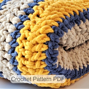 May include: A crocheted blanket with stripes of yellow, beige, and blue yarn. The blanket is folded in half and the text "Crochet Pattern PDF" is visible at the bottom of the image.
