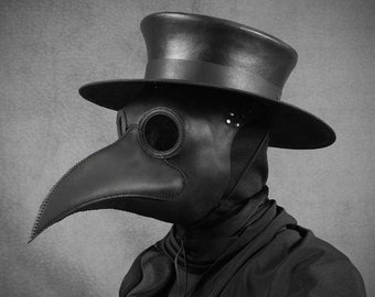 May include: A black leather plague doctor mask with a long beak and a round eye piece. The mask is worn with a black top hat and a black cloak.