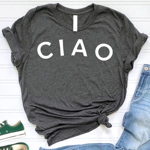 May include: A dark gray t-shirt with the word "CIAO" printed in white on the front.