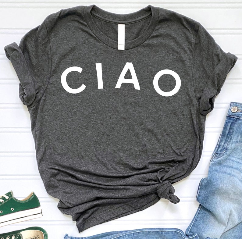 May include: A dark gray t-shirt with the word "CIAO" printed in white on the front.