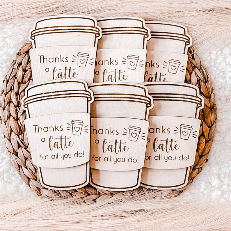May include: Six wooden coffee cup sleeves with the text "Thanks a latte for all you do!" and a small heart graphic.