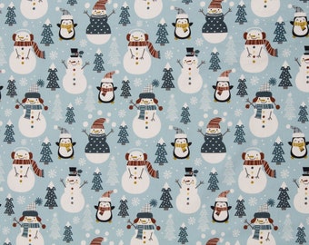 Cotton woven fabric snowmen and penguins, white-green on light blue, "Belle" by Swafing, cotton fabric sold by the meter